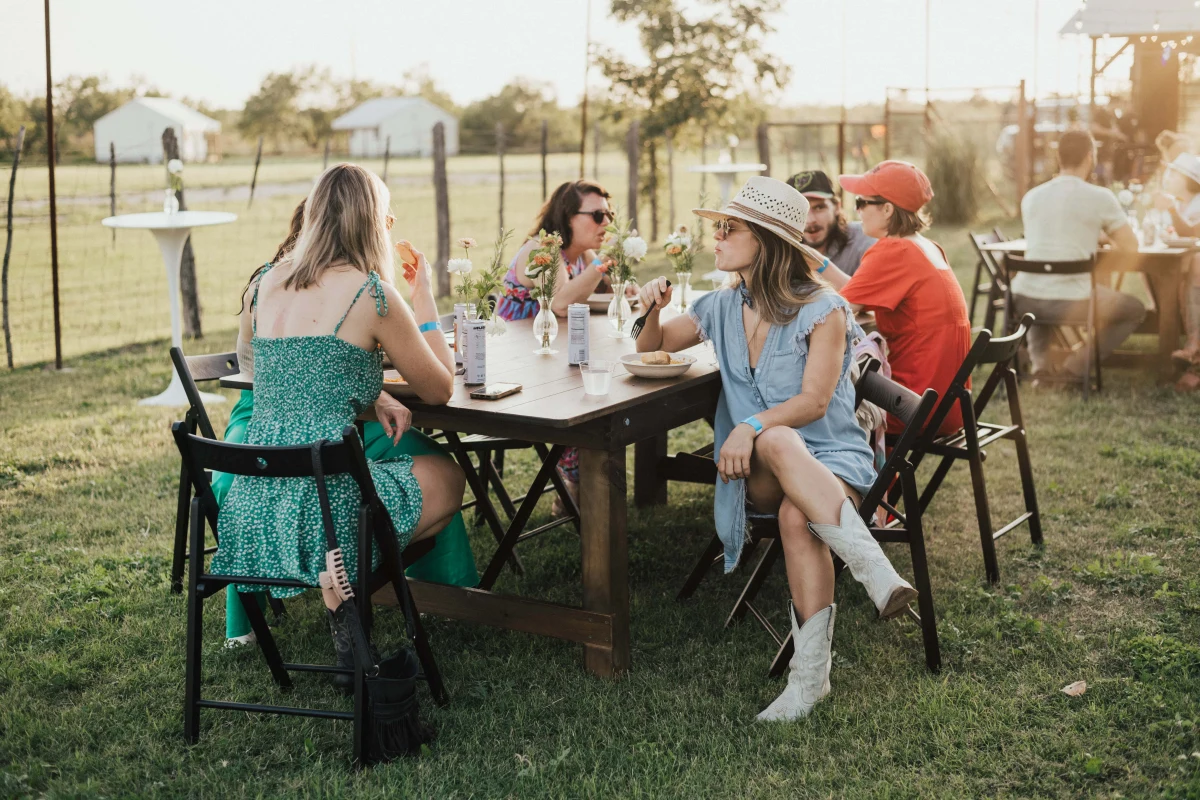 Team gathered around a fire pit at a ranch corporate retreat near Austin Texas — Rancho Moonrise