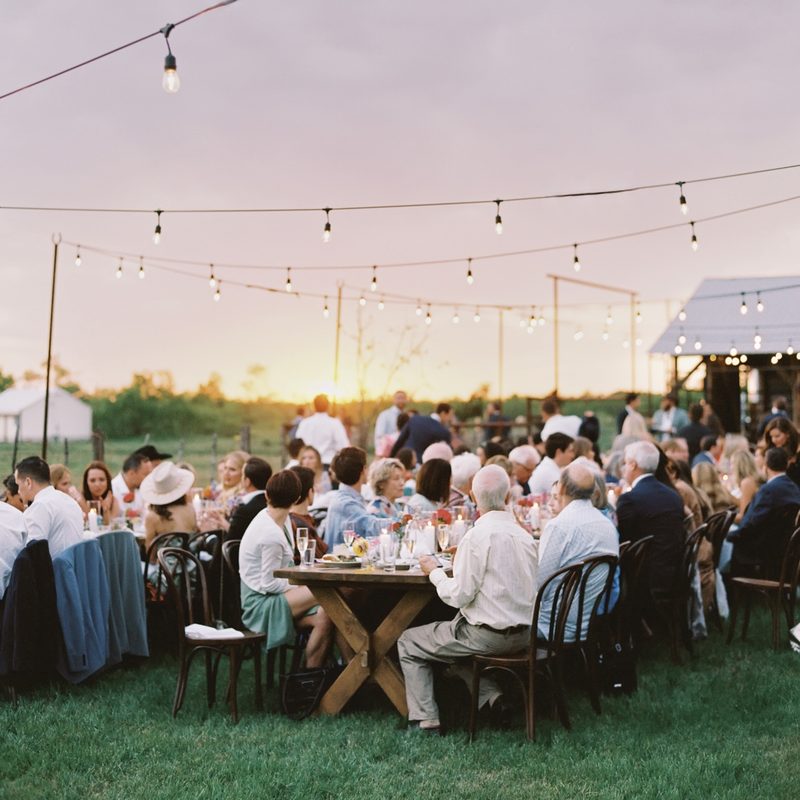 Outdoor gathering under string lights at Rancho Moonrise