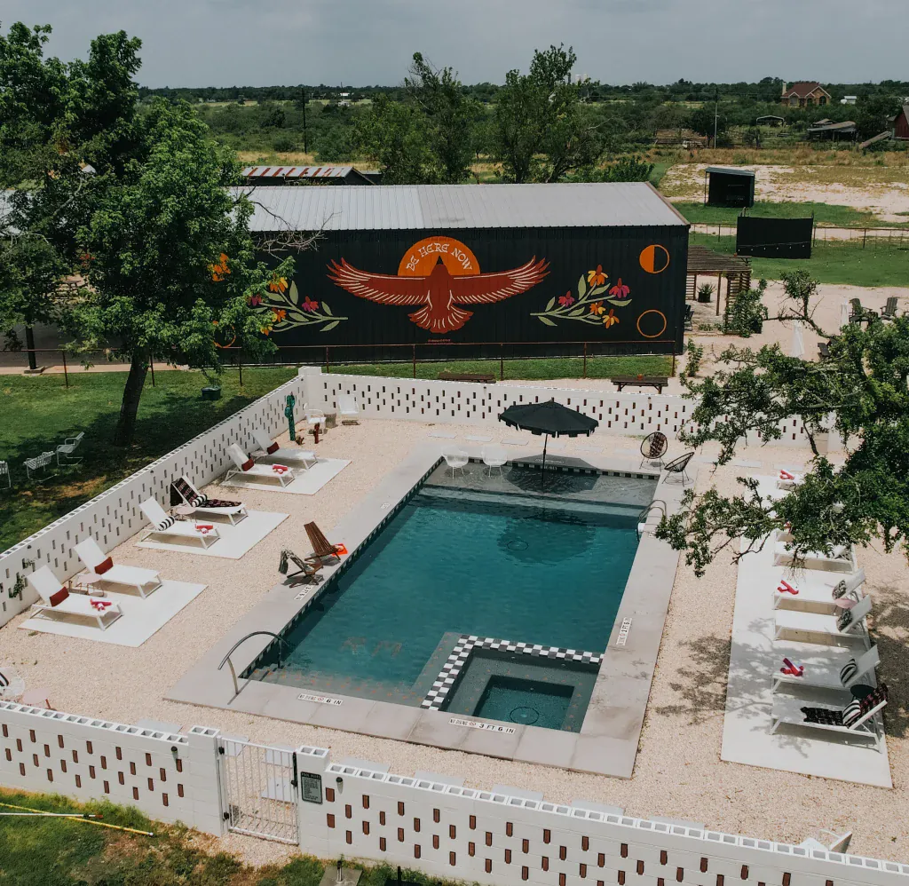 Rancho Moonrise swimming pool, lounge chairs, and mural