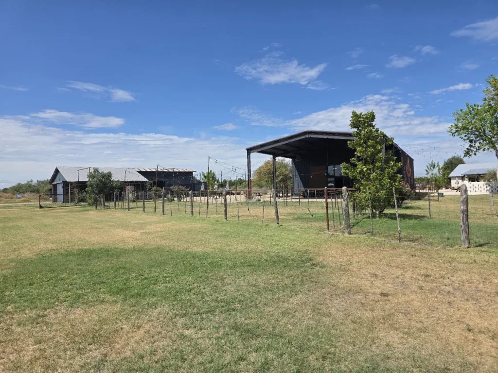 Open ranch grounds and event buildings at Rancho Moonrise