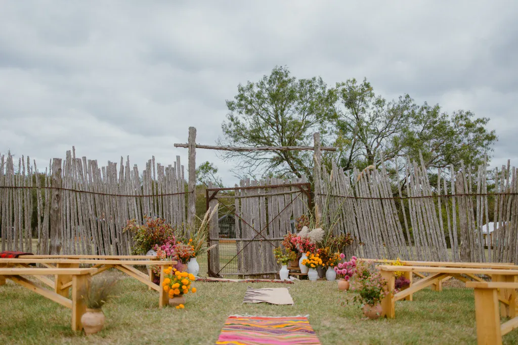 Wedding ceremony seating and floral decorations in the corral