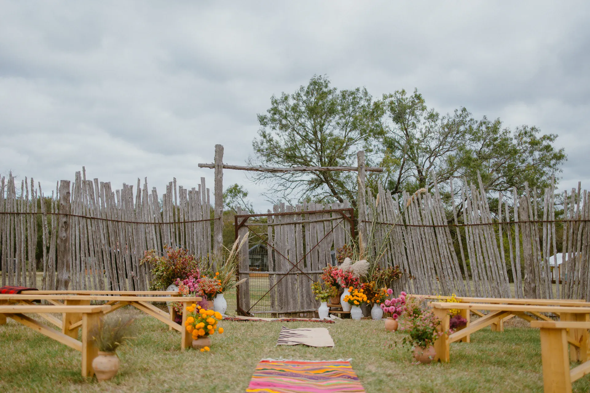 Wedding ceremony seating and floral decorations in the corral